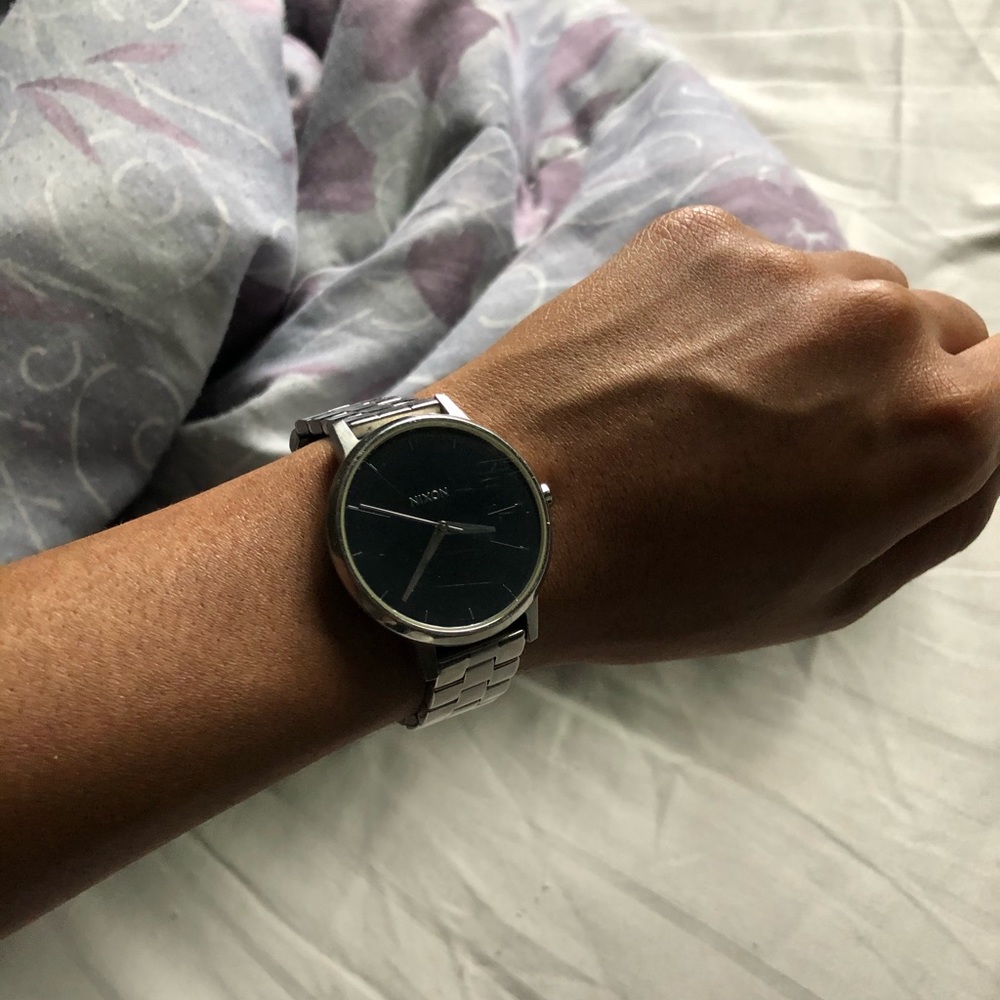 Nixon black face silver watch